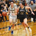 Spartan Kaitlyn Davis drives past Viking Teegan DeVries.