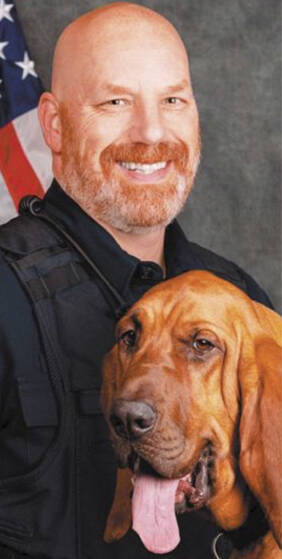 K-9 officer Kurt Enget, with his dog Whitney, died of COVID.