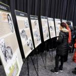Attendees look over displays.