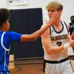 Nicholas Zeller-Singh/Kitsap News Group Photos
Spartan Sam Nylund battles Knight Jalen Davis until the final buzzer.