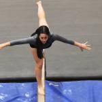 Analee McDonald shines for Kingston on the balance beam.