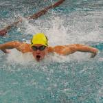 Robbie Nakhuda wins the 50-yard freestyle and 100-yard butterfly for Bainbridge.
