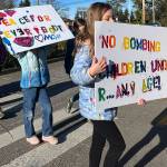 Students carry signs during the march for peace Jan. 15.