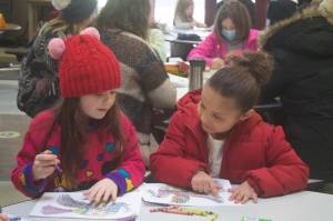 Molly Hetherwick/Kitsap News Group Photos
Vivica Jolley and Talula Walle Talbot compare art pieces at the Student March for Peace Jan. 15.
Molly Hetherwick/Kitsap News Group Photos
Vivica Jolley and Talula Walle Talbot compare art pieces at the Student March for Peace Jan. 15.