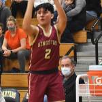 Buc Chayton Walker shoots a three-pointer.