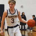 Nicholas Zeller-Singh/Kitsap News Group Photos
Spartan Sam Nylund drives toward the hoop.