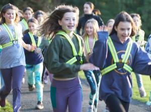 Molly Wetherwick/Kitsap News Group Photos
Riley Lambert, Nikka Heiskanen and Amelie Hill of Go Run Bainbridge jog during a recent practice.