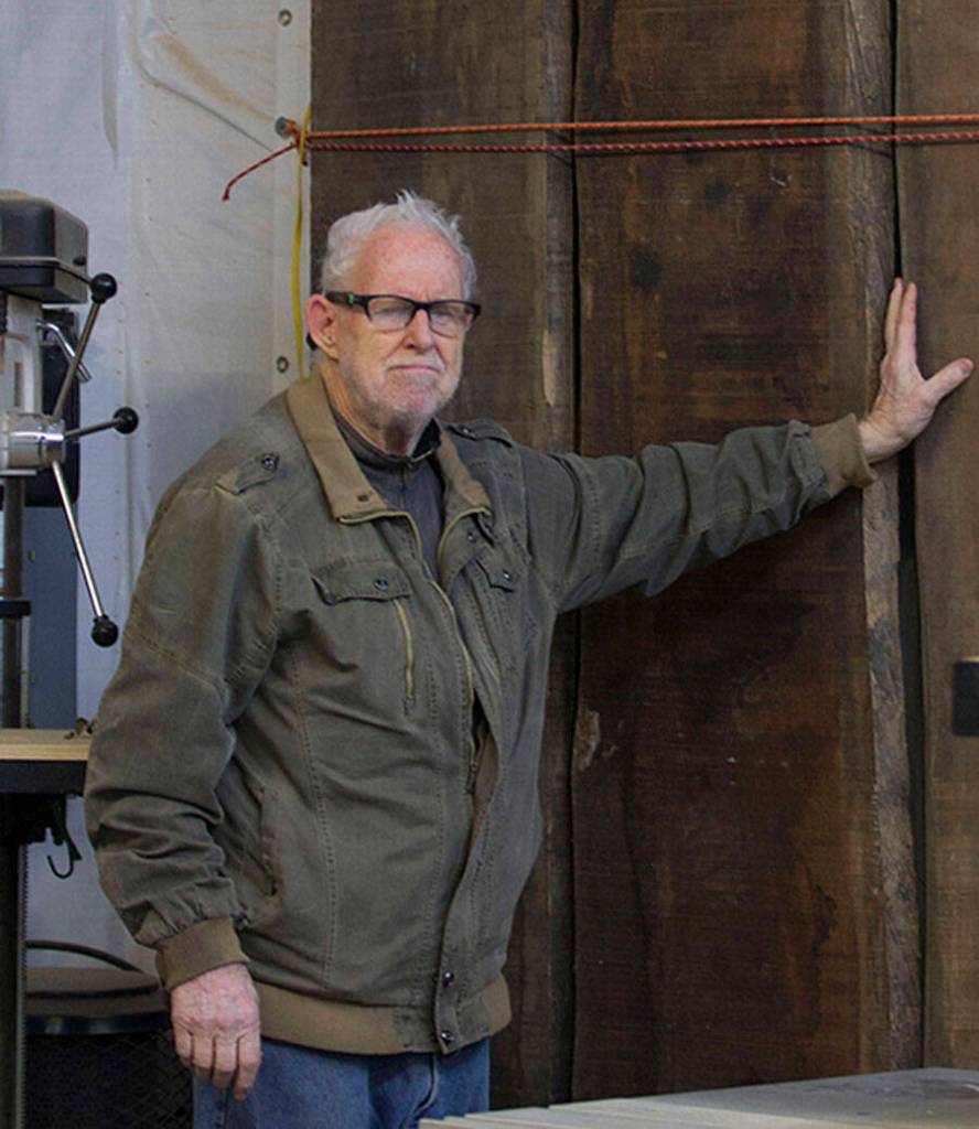 John Steiner with three of the merbau wood planks that started his business.