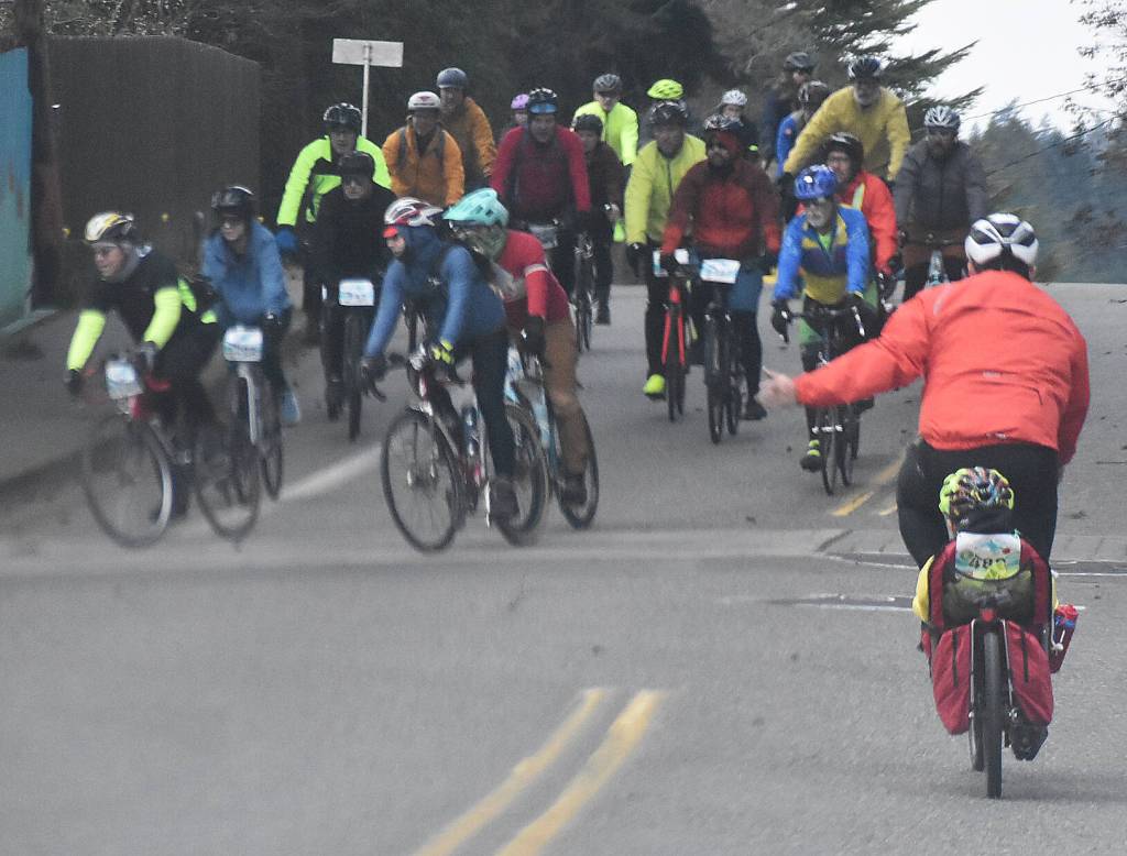 Several cyclists ride alongside each other during Chilly Hilly.