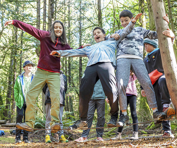 Keith Brofsky, IslandWood courtesy photos
Kids balance on a slackline during an overnight school trip to IslandWood last fall.