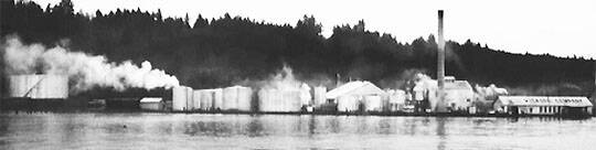 The Wyckoff plant in the 1980s. The container at left held up to 1 million gallons of creosote.