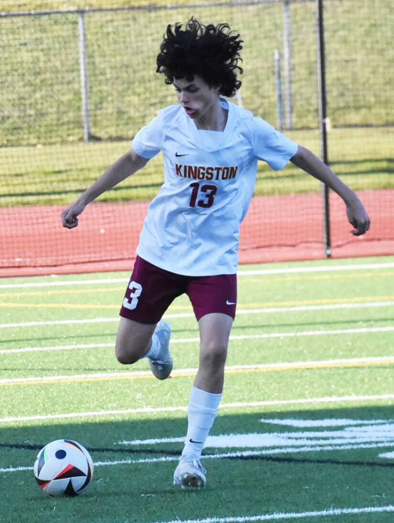 Buc Griffin Clark passes the ball upfield.