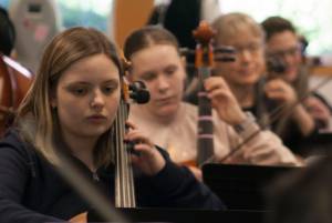 Molly Hetherwick/Kitsap News Group photos
Cellists Olive Leiss, left, May Smaus, Barbara Deppe and Christine Edwards practice at rehearsal April 12.