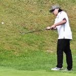 Kingstons Ben Decker flops the ball on the green.