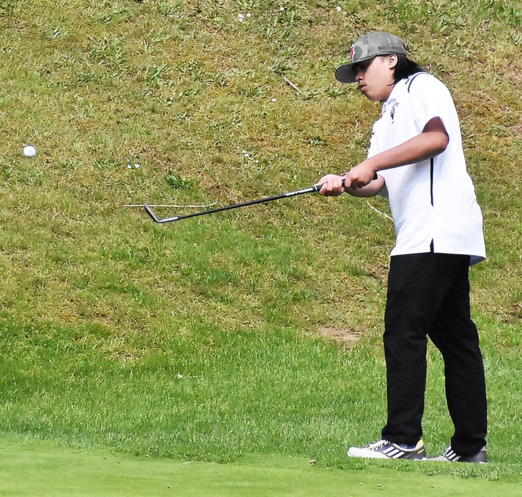 Kingstons Ben Decker flops the ball on the green.