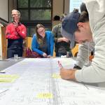 Molly Hetherwick/Kitsap News Group photos
James Allen adds a note to a topographical map of Valley Road.