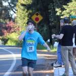 Daniel Lybeck drinks some water before continuing his run on the marathon course.