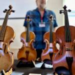 Handmade violins were sold at the event.