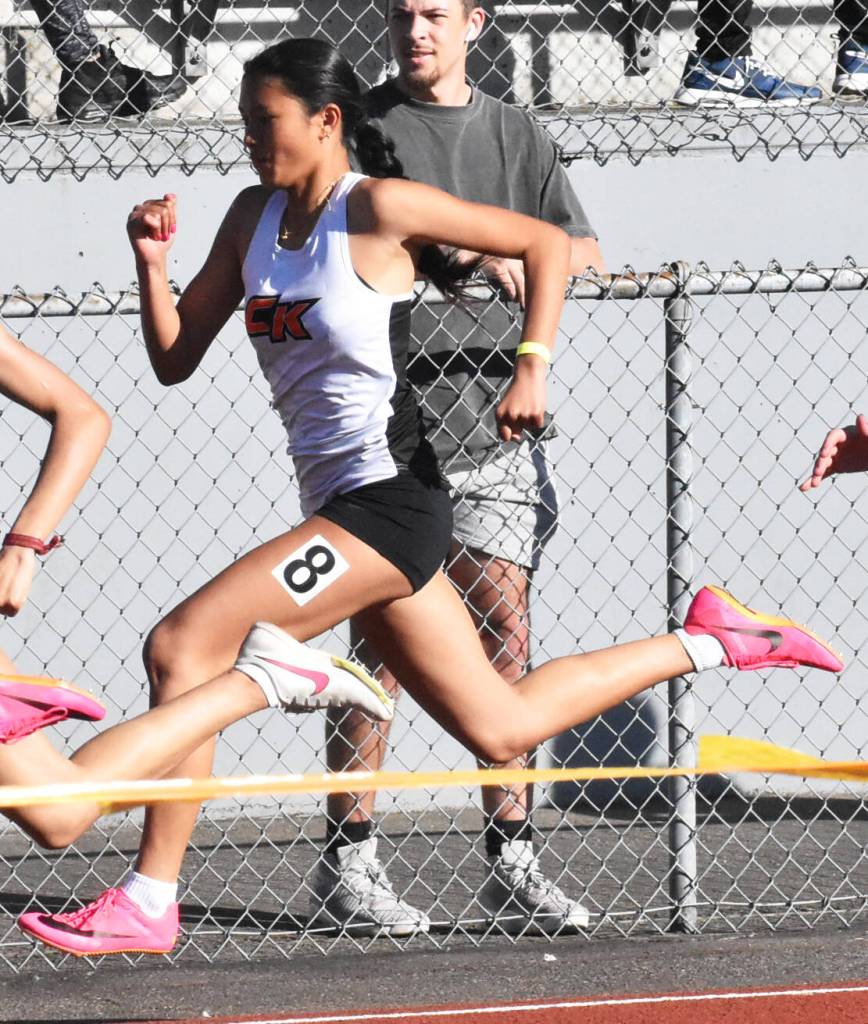 Cougar Maleia Dayao races in the 100 meter.