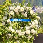 A wreath bearing a single blue stripe is dedicated to the fallen law enforcement officers throughout Kitsap County.