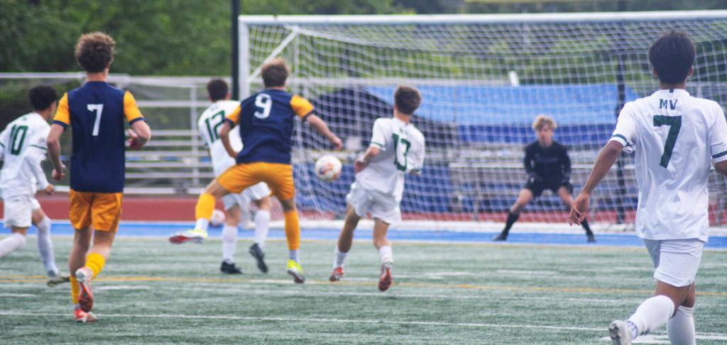 Cruz Piland (9) takes a shot at the goal early in the contest for the Spartans.