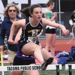 Spartan Sabine Hartenstine competes in the hurdles.