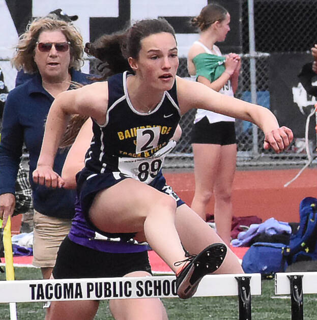 Spartan Sabine Hartenstine competes in the hurdles.