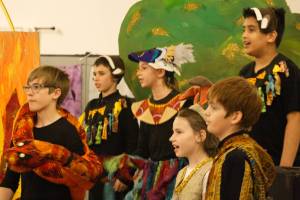 Students gather to sing a closing number for the West African musical.