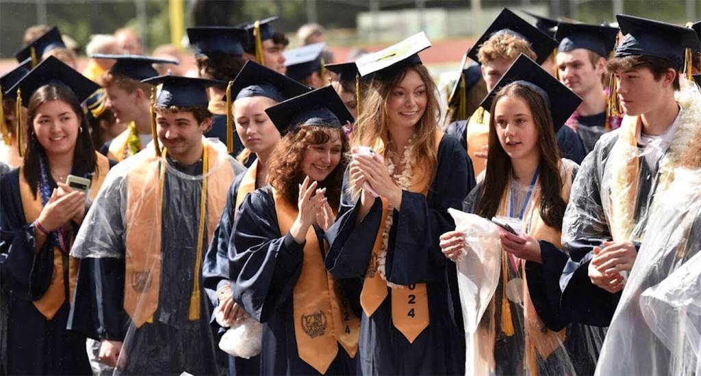 These graduates are in a better mood as the sun came out for a short period of time.