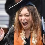 Isabel White yells out with excitement after receiving her diploma.