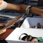 An attendee peruses the free Juneteenth swag.
