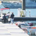 Steve Powell/Kitsap News Group photos
Some folks walk along the docks at Eagle Harbor looking at the boats on a recent sunny day.