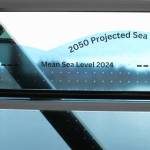 Molly Hetherwick/Kitsap News Group photos
A window decal demonstrating global sea level rise, installed on a window of the Bainbridge Island Ferry Terminal June 28.