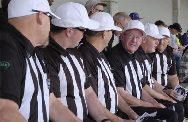 Referees from the Peninsula Football Officials Association show up in uniform to show their support for coach Dave Snyder.