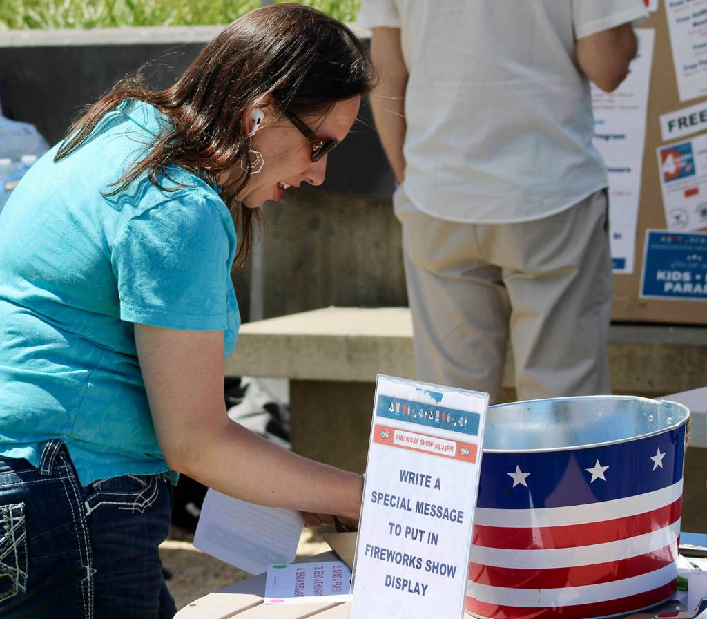 Parade attendees were invited to write a message to be shot into the sky for the night's firework show.