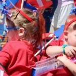 Little ones throw out candy to the small group watching the parade.