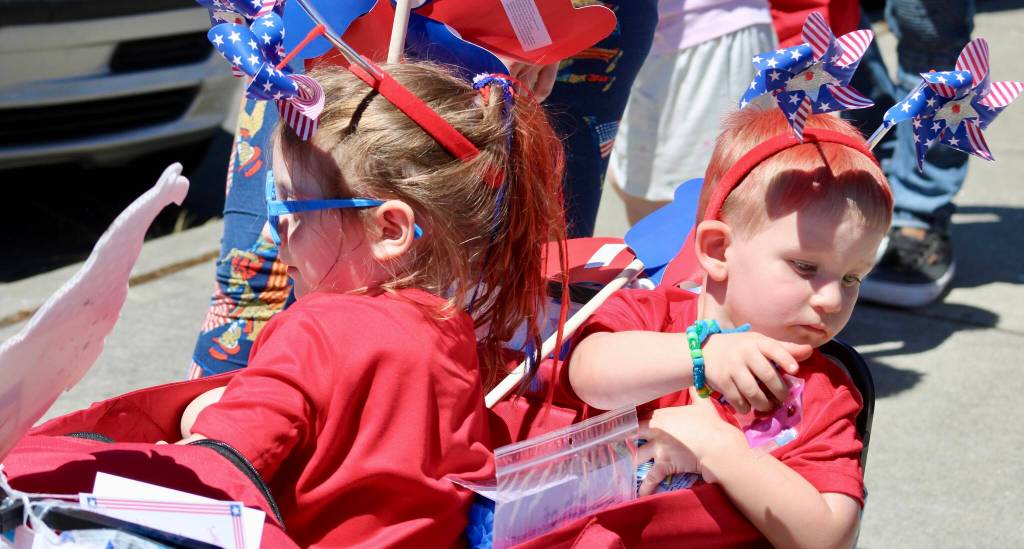 Little ones throw out candy to the small group watching the parade.