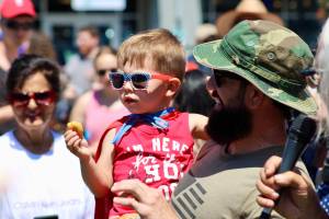 Elisha Meyer/Kitsap News Group photos
Flint Getchell tastes victory with a donut and a first-place prize at the annual Manchester Kids and Pet Parade.