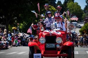 Jonathan Palmer courtesy photos
Uncle Sam drives an antique vehicle packed with folks in July 4 regalia in front of the many visitors who attended the Grand Old 4th of July in Bainbridge Island Thursday.