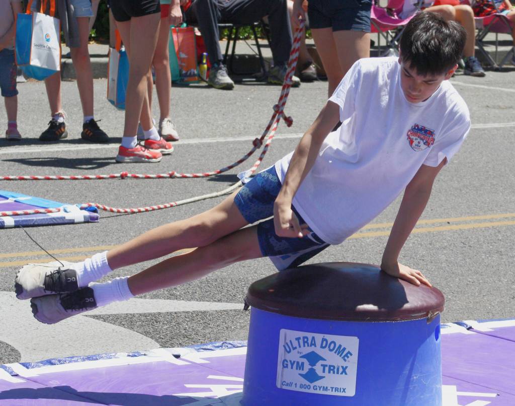 The Bainbridge gymnastics team performed handsprings, flips and pommel horse maneuvers for onlookers at the parade.