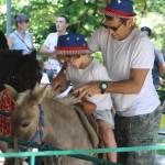 A dad and his son enjoyed the pony rides.