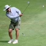 Damon Williams/Kitsap News Group photos
Seahawks legend Steve Largent chips the ball onto the green.