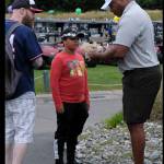 Ex-Seahawk fullback Mack Strong signs an autograph at the event.