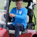 Former Seahawk quarterback Jim Zorn gets behind the wheel of a golf cart.