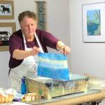 Victoria Foster Harrison demonstrating her encaustic technique in the gallery.