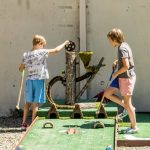 Bryce Moulton courtesy photos
Two attendees assist the squirrels with their golf ball at the Camp Mulligan mini-golf course on Bainbridge Island.