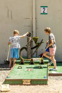 Bryce Moulton courtesy photos
Two attendees assist the squirrels with their golf ball at the Camp Mulligan mini-golf course on Bainbridge Island.