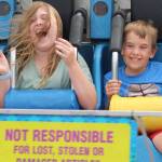 Sofie and Gabe cant help but scream and hang on during a carnival ride at the Kitsap Fair and Stampede, which runs through Sunday.