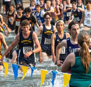 BHS XC courtesy photo
Senior Jack Thompson and Junior Andrew Domansky push through almost waist-high waters in Lake Wilderness at Saturdays Tahoma Relays. They were on the Bainbridge team that placed 13th.
