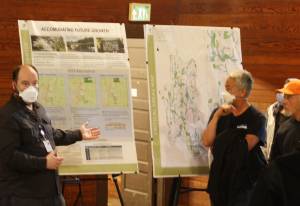 Molly Hetherwick/Kitsap News Group photos
BI senior planner Peter Best gestures to a posterboard titled Accommodating Future Growth during a Q&A session with Island Center residents.